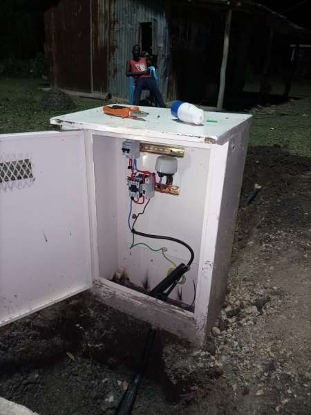 Inside of an open outdoor control panel, with neatly labelled wiring and Tier-1 components.